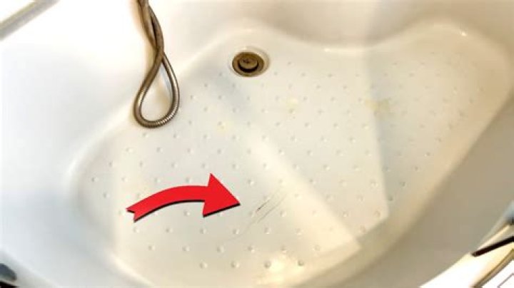 Can a cracked acrylic tub be repaired?