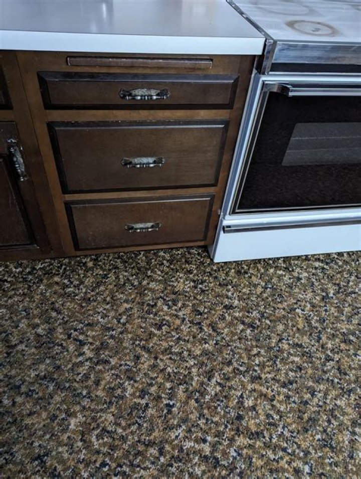 Do you lay tile under cabinets