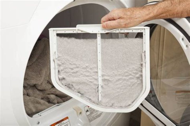 How do I clean the lint trap in my front load dryer