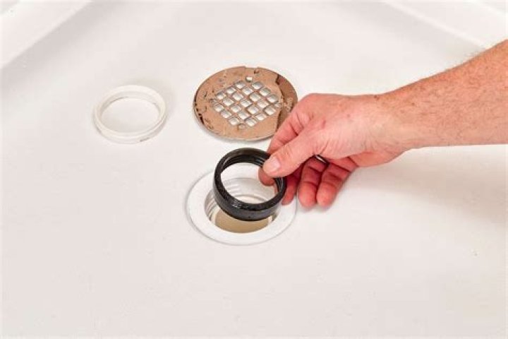How do I keep my shower drain from clogging?