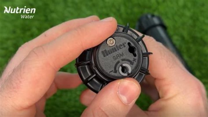 How do you adjust a pop-up sprinkler?