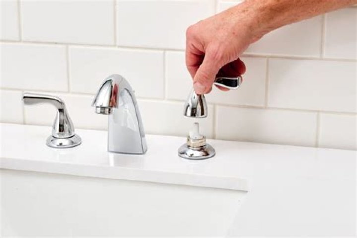How do you fix a leaking double knob in a bathroom faucet?