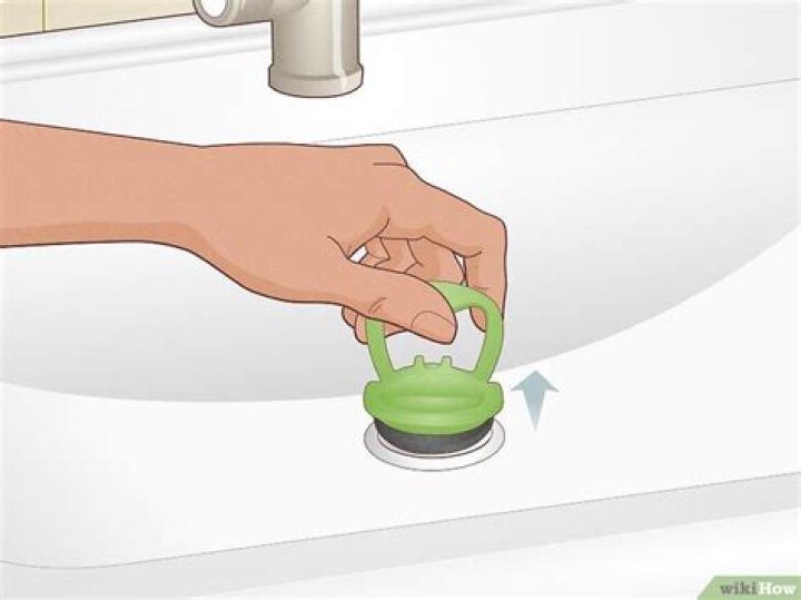 How do you get a stuck bathroom sink stopper out?
