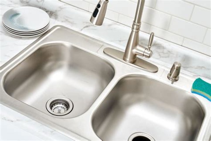 How do you plumb a double kitchen sink with a garbage disposal?