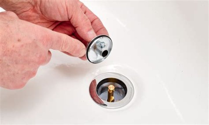How do you remove a tub faucet surround?