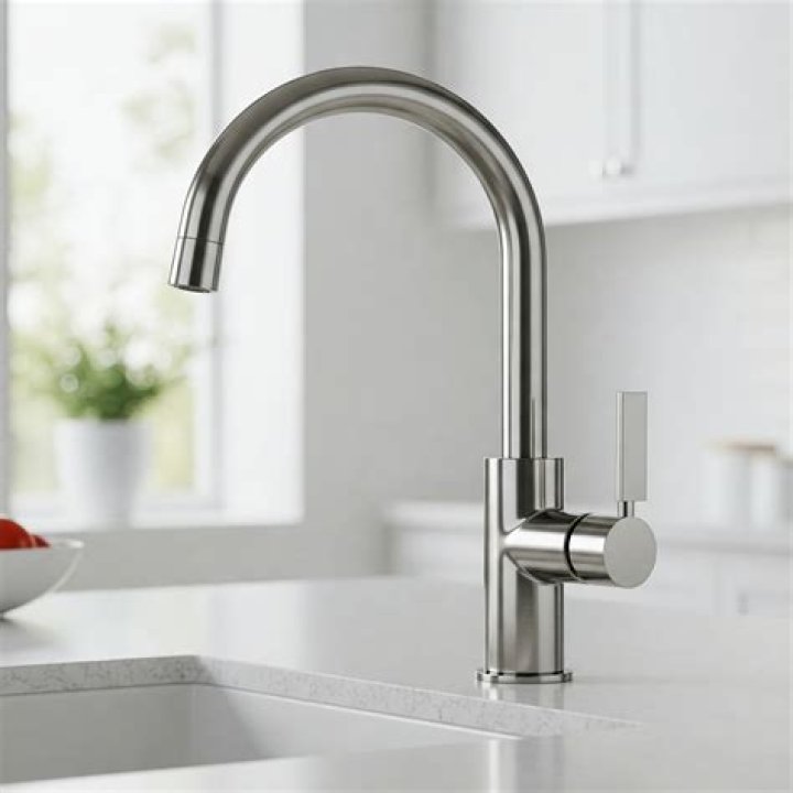How do you tighten a single lever kitchen faucet?