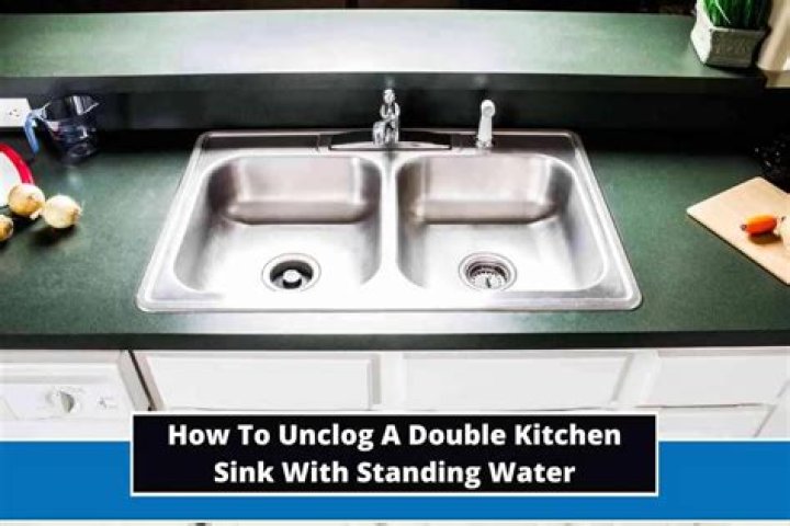 How to unclog a double kitchen sink with standing water?