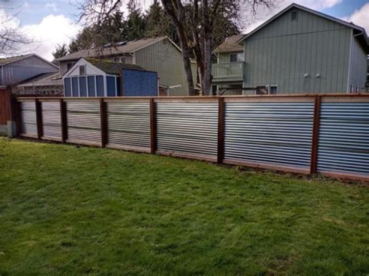 Is wood fence cheaper than metal