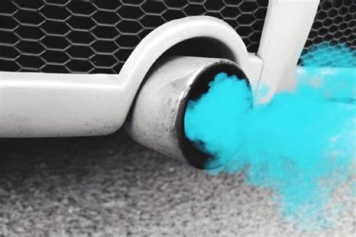 What causes light blue smoke from exhaust