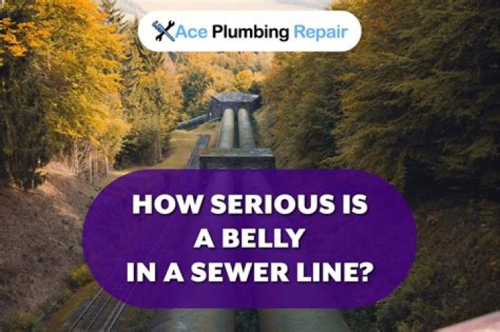 What is the cause of a belly in a sewer line?