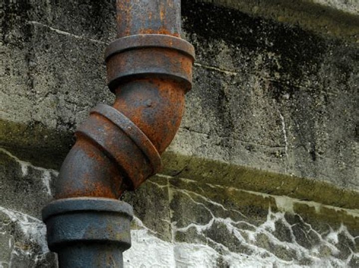 When should cast iron pipes be replaced?