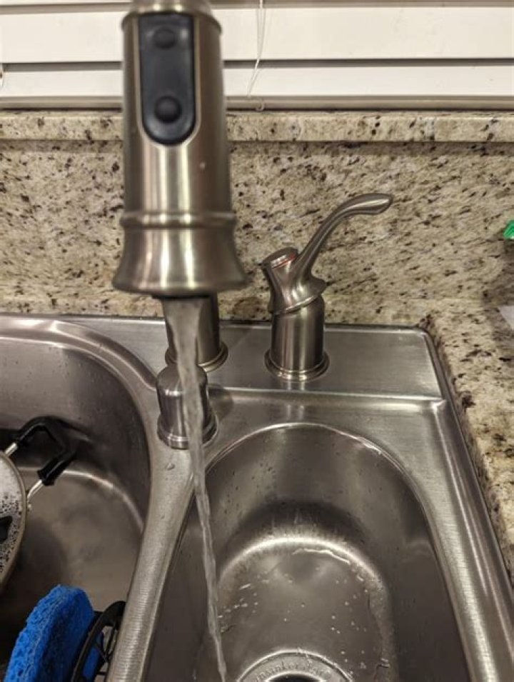 Why did I lose water pressure in my kitchen sink?