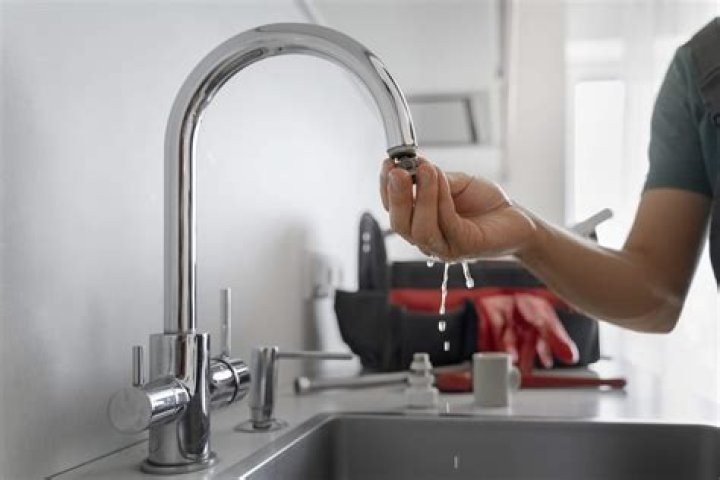 Why does my kitchen tap release a little bit of water every few hours?