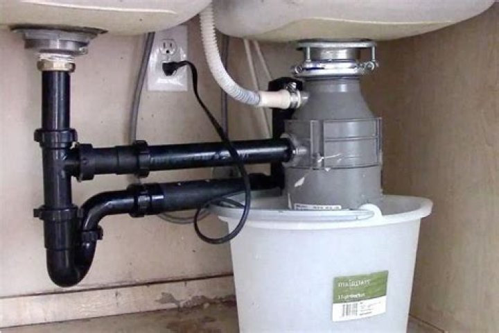 Why is my new garbage disposal leaking from the bottom?